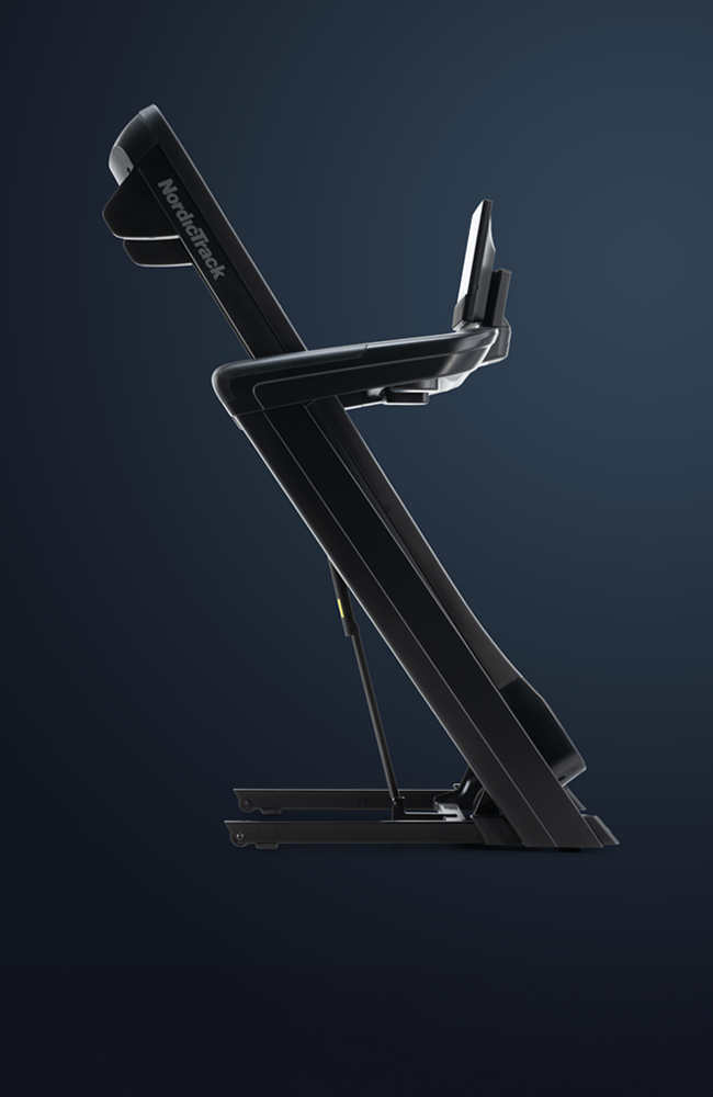 Man doing leg stretches on NordicTrack 2450 Treadmill