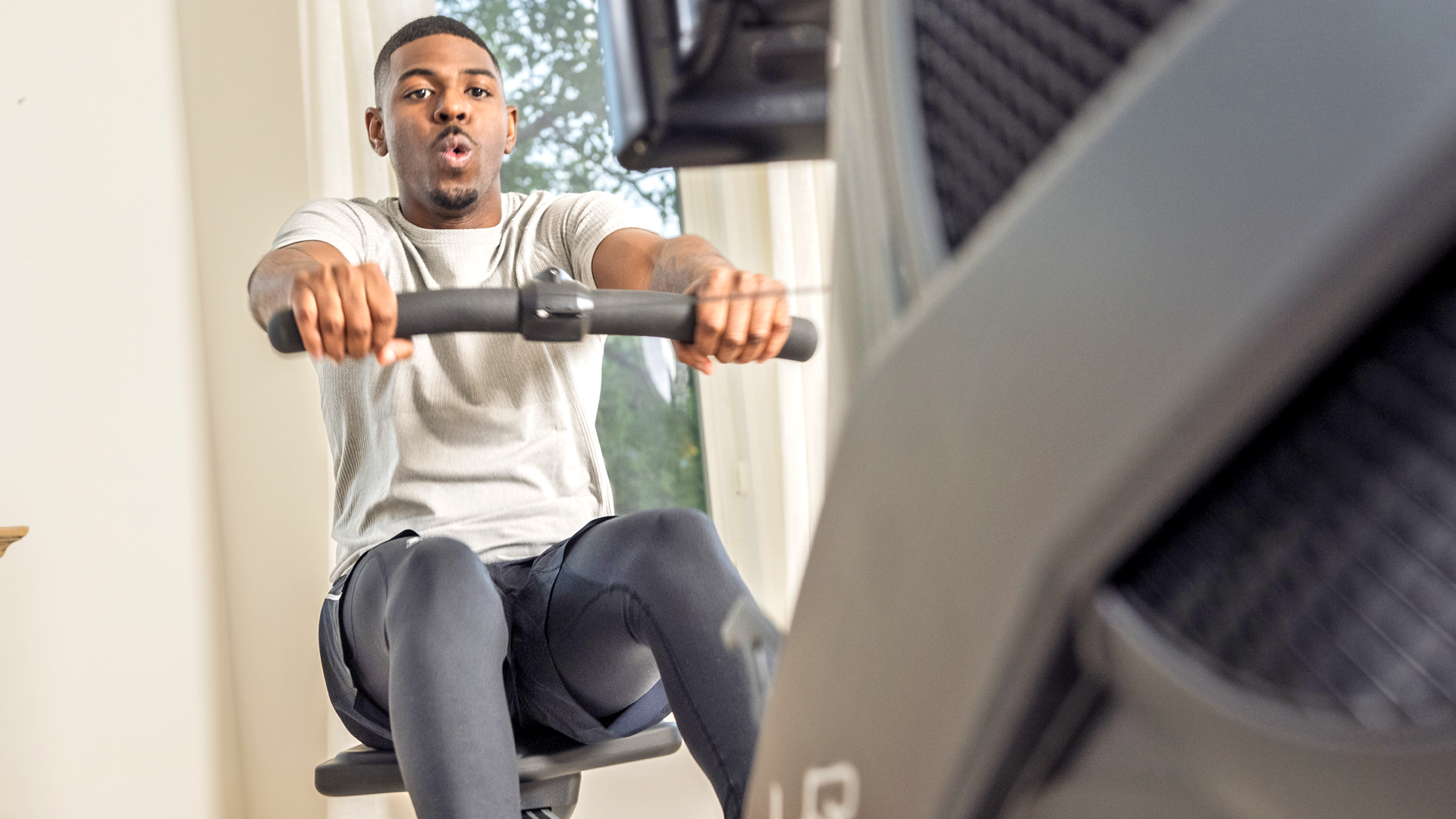Man working out on Bodycraft VR500 Rower