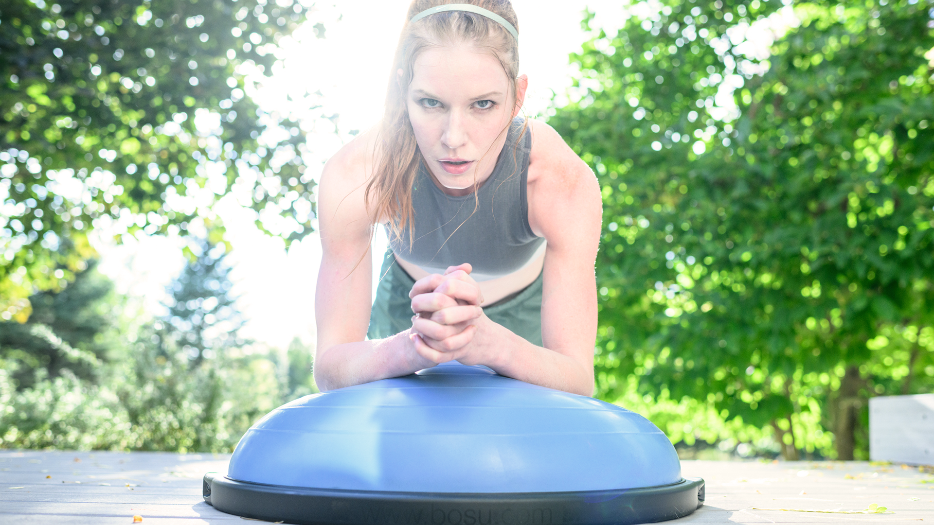Woman on BOSU® Home Balance Trainer