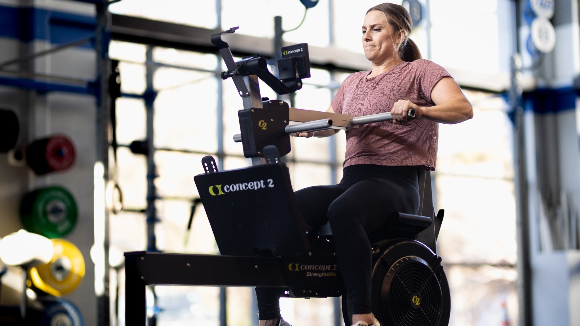 Woman working out on Concept2 StrengthErg