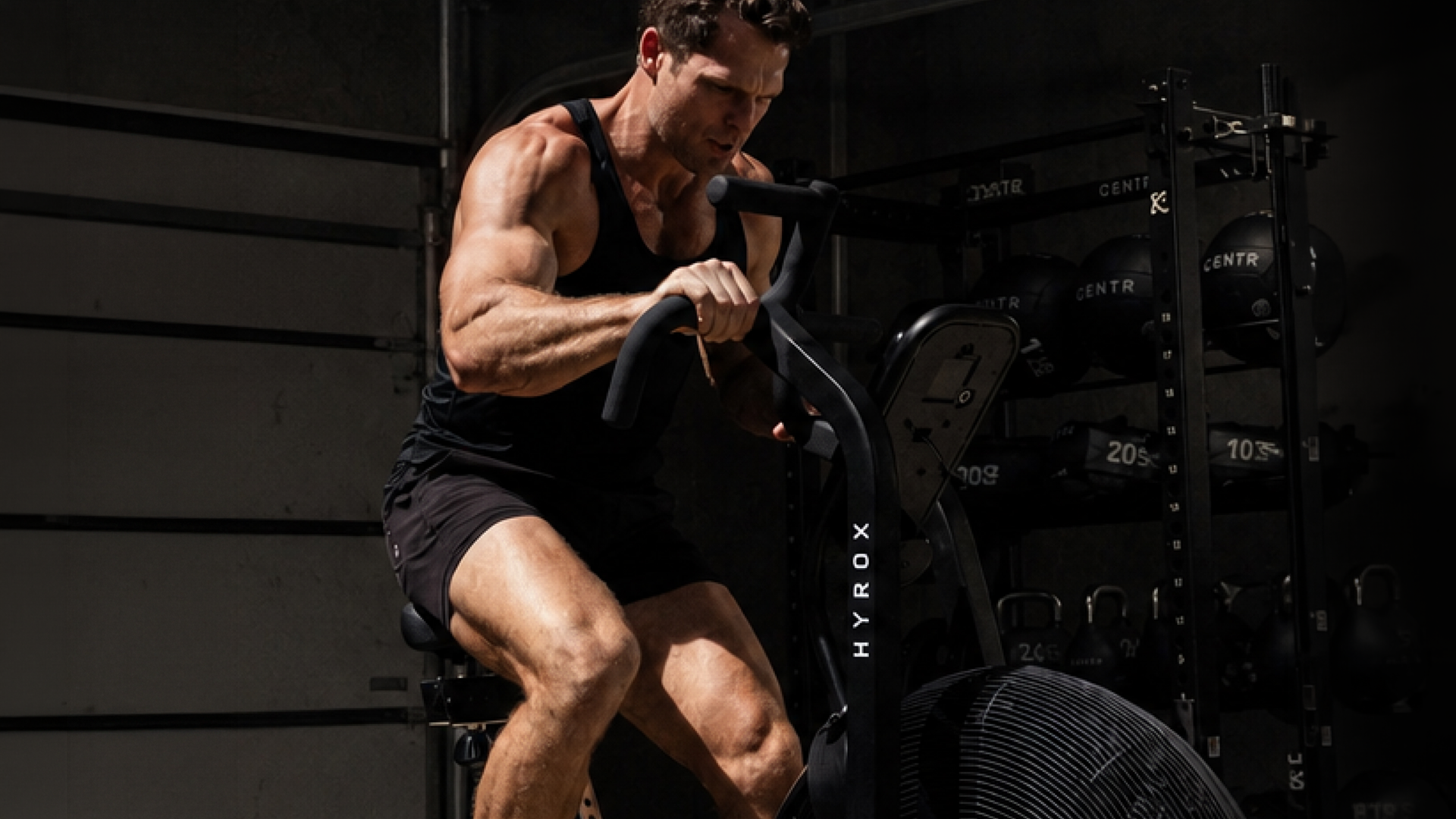Male athlete training on Centr x HYROX Perform Series Air Bike