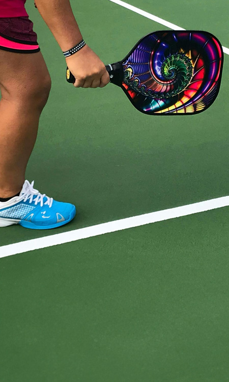 Closeup of woman playing pickleball