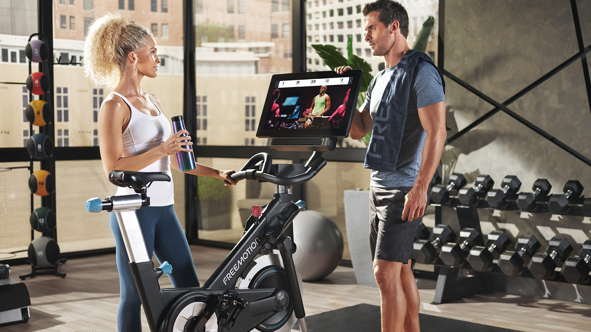 Couple by Freemotion CoachBike in gym