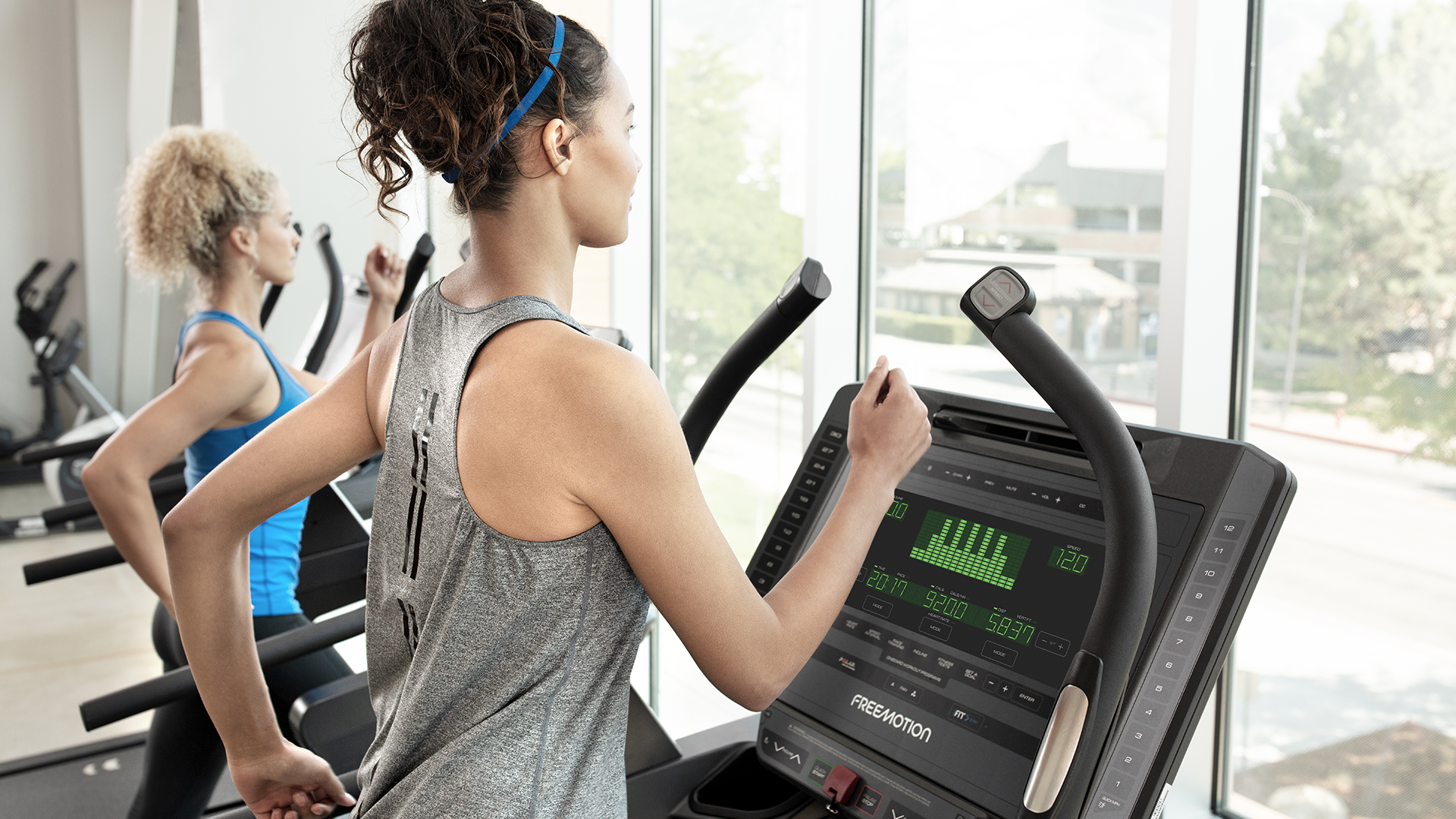 Woman on Freemotion Incline Trainer console
