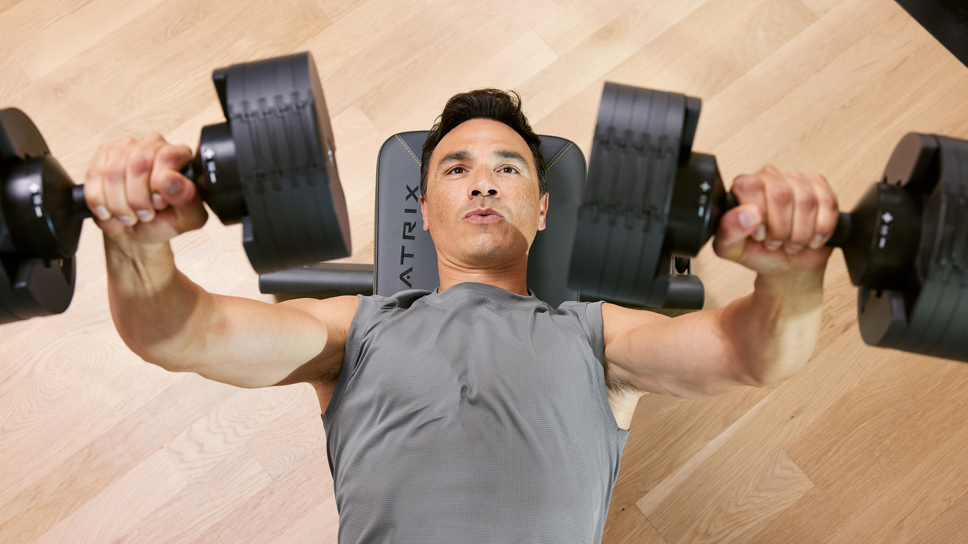 Man doing dumbbell presses