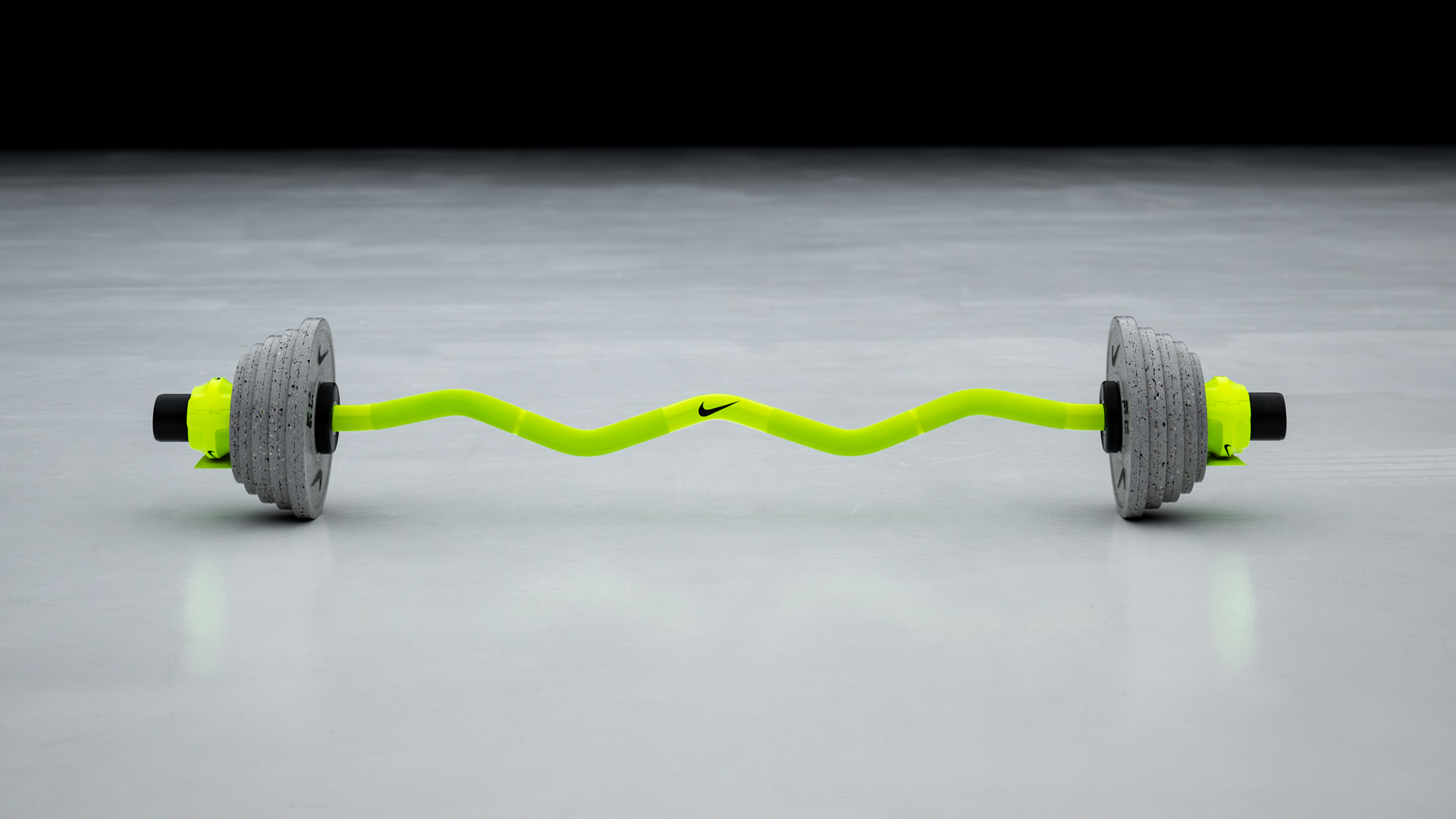 Nike Grind Change Plates loaded on a barbell