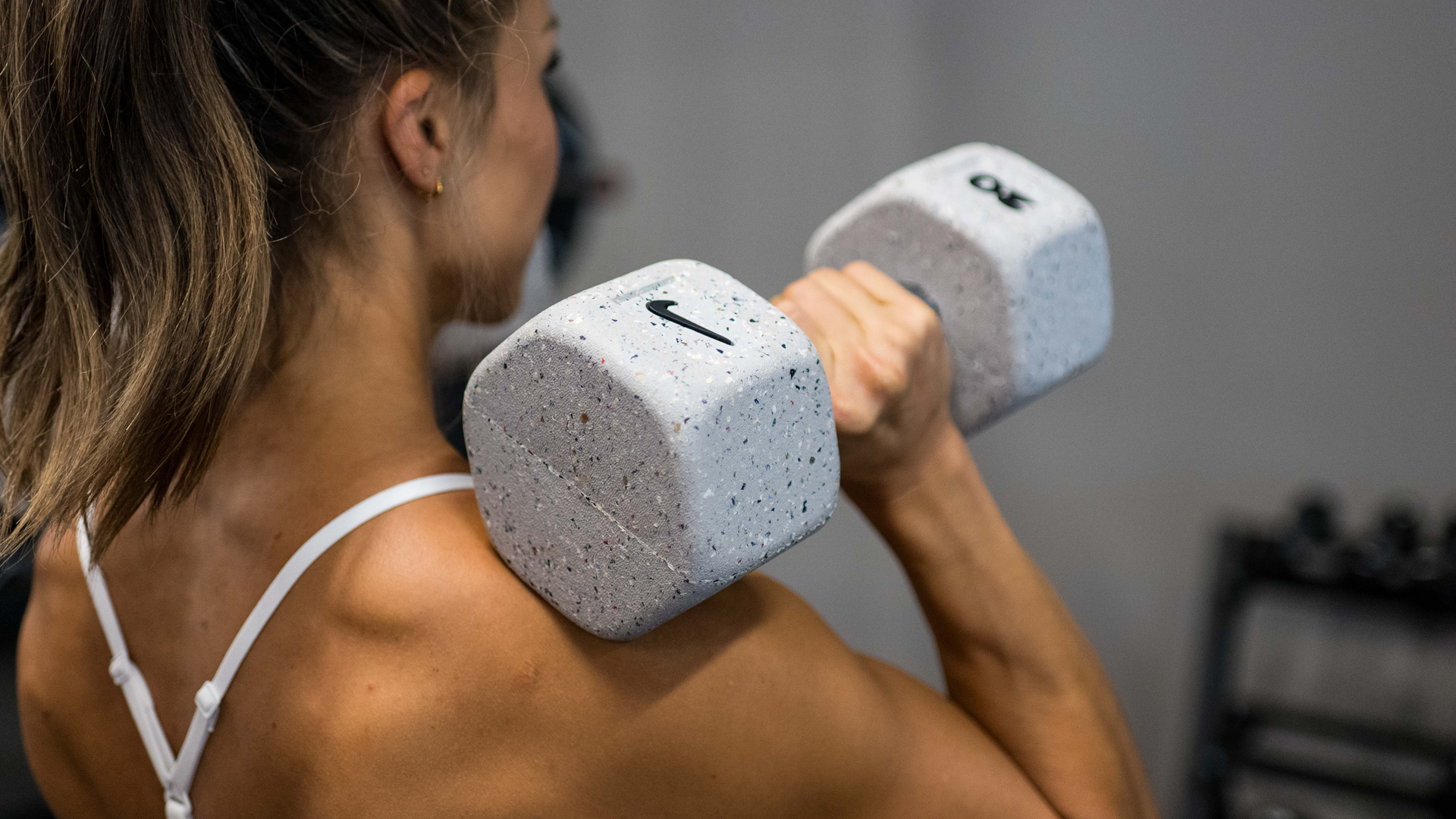 Nike Grind Dumbbells in a strength training space