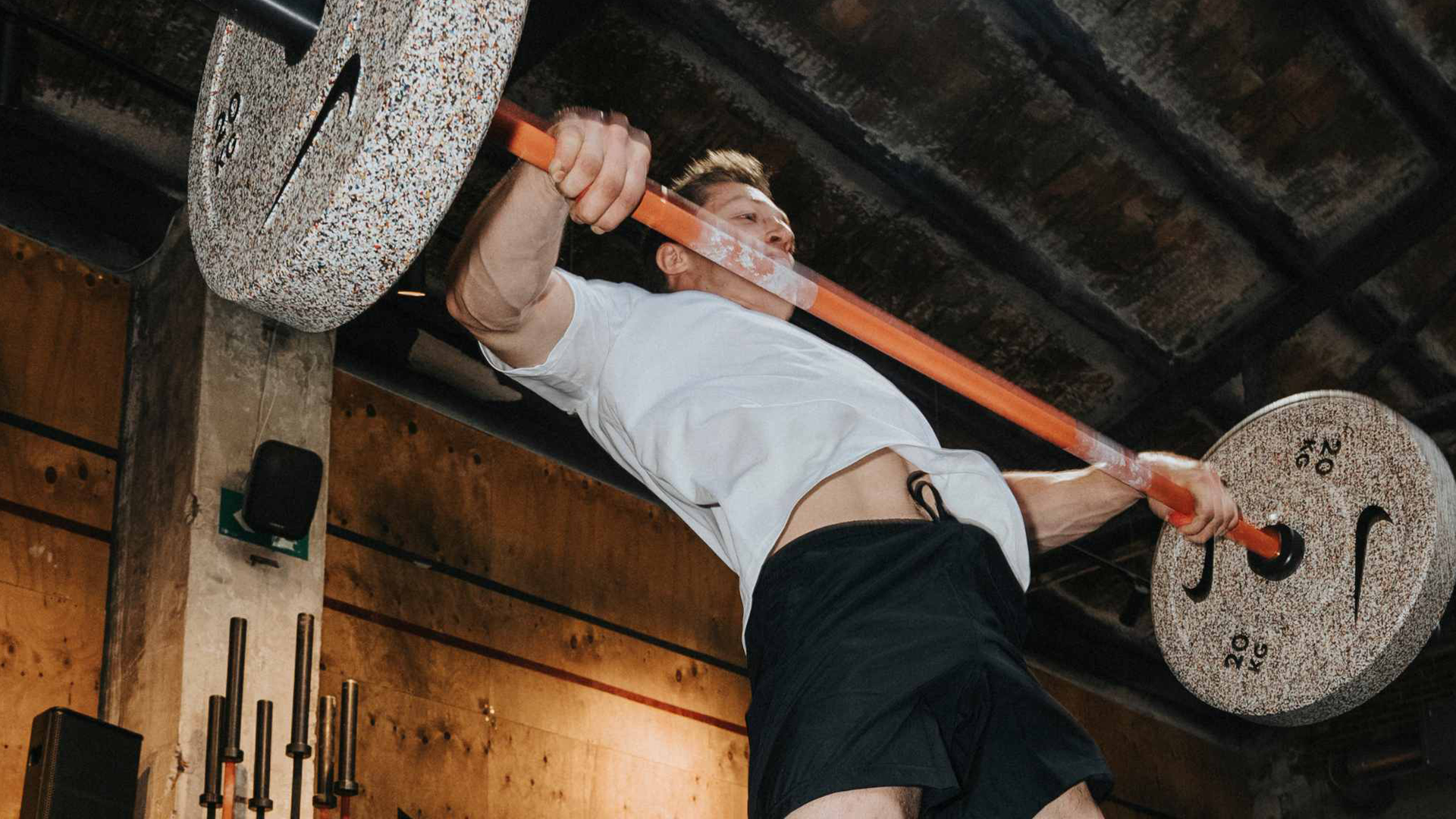 Nike Strength Shield Barbell 20kg in a strength training space