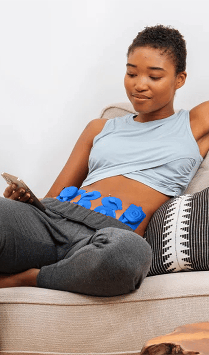 Woman relaxing using Therabody PowerDot Duo 2.0 on stomach