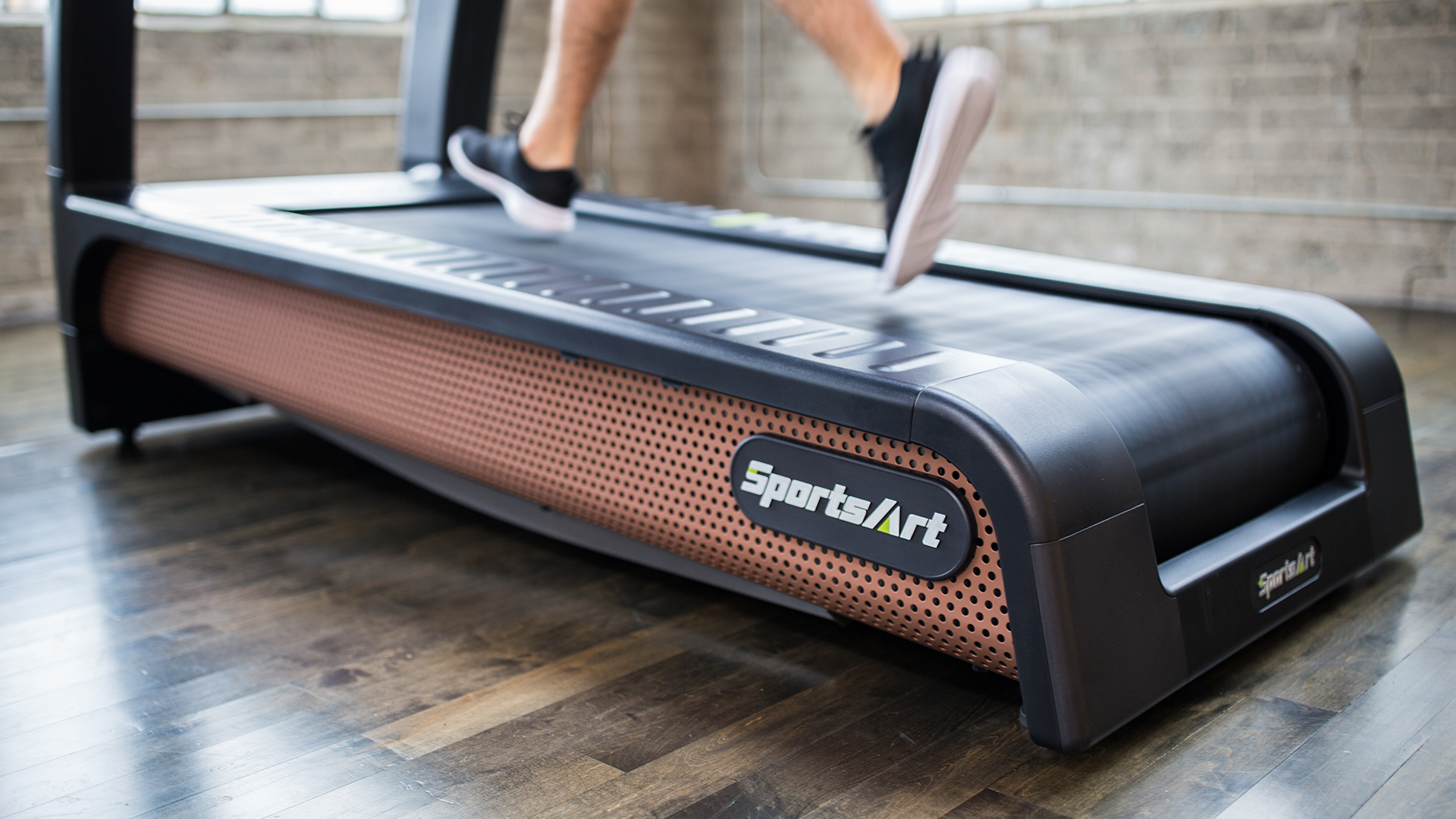 Man running on SportsArt T676