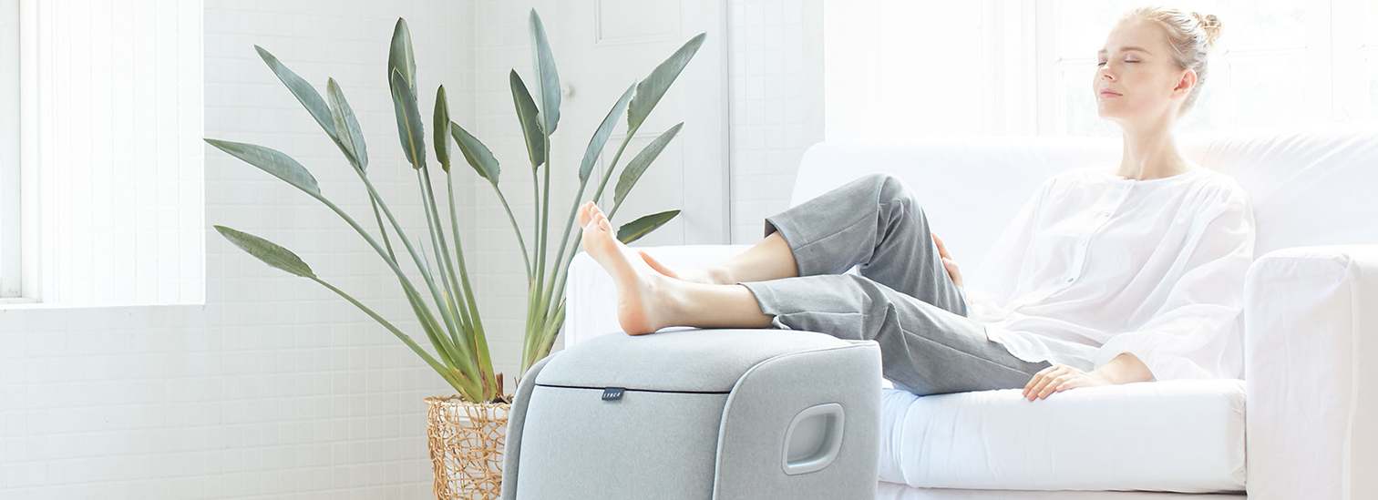 Woman relaxing with REI Massager