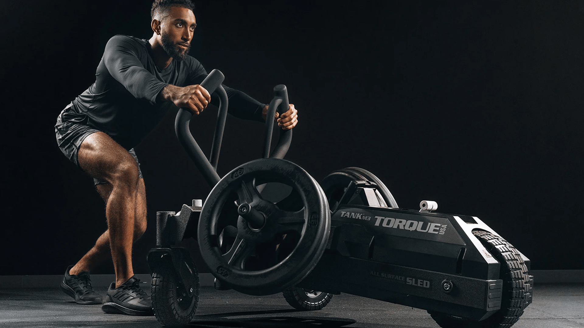 Man working out with Torque Tank™ M3