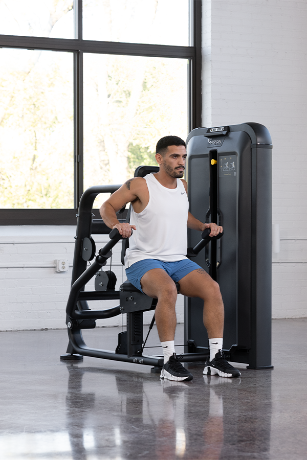 Woman using Vision Fitness Keystone Triceps Press