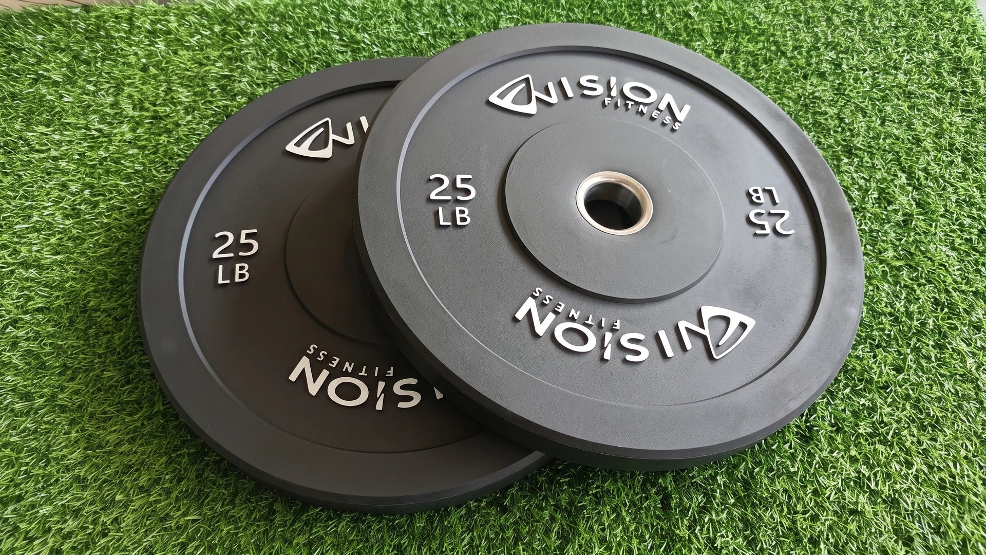 Two Vision Fitness Rubber Bumper Plates on artificial turf