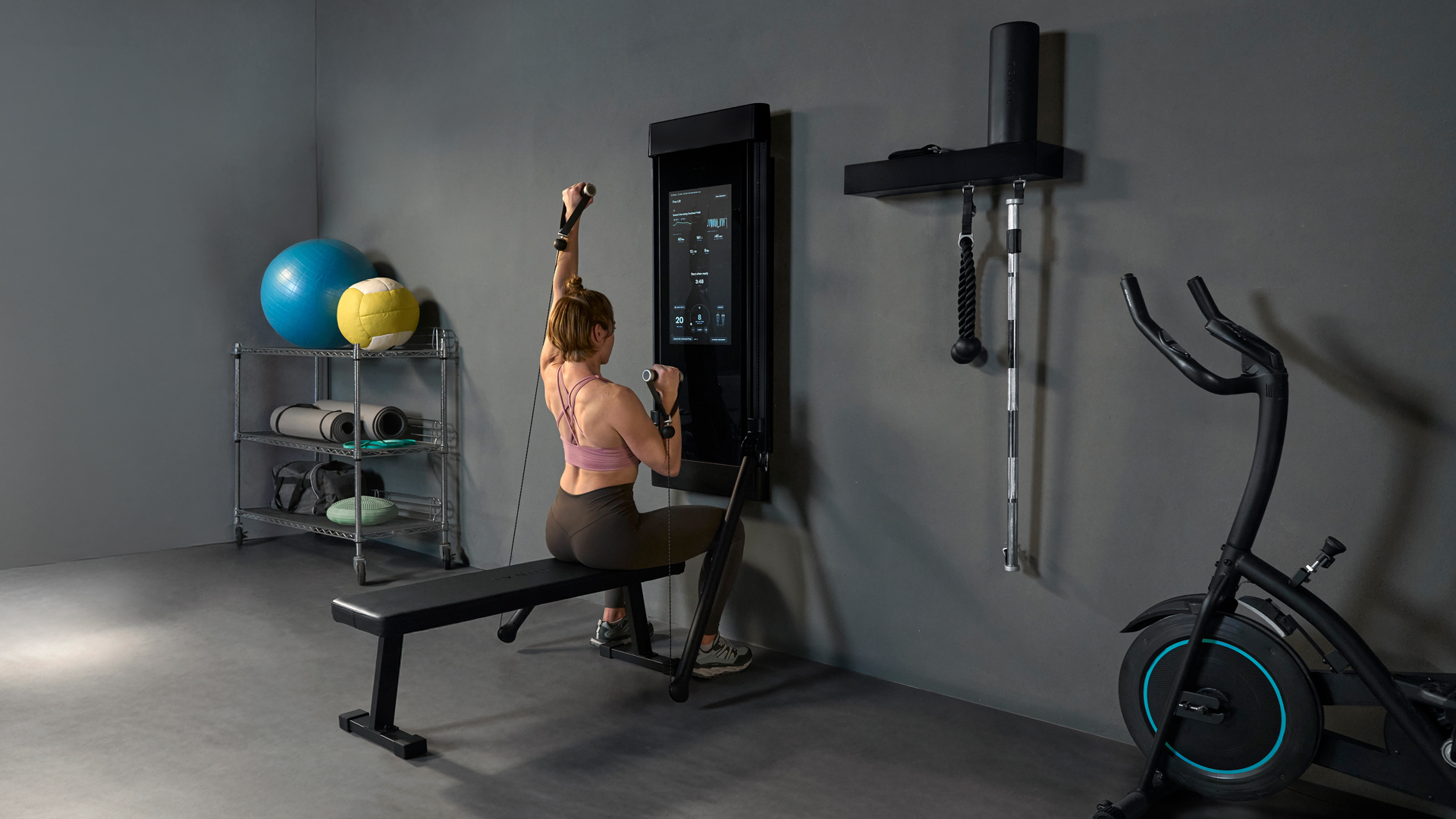 Woman working out on Tonal 2 Smart Gym