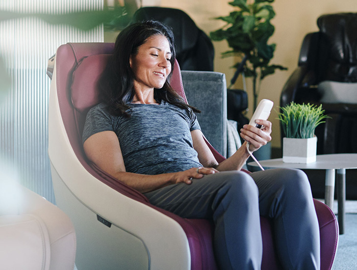 Woman sitting in massage chair