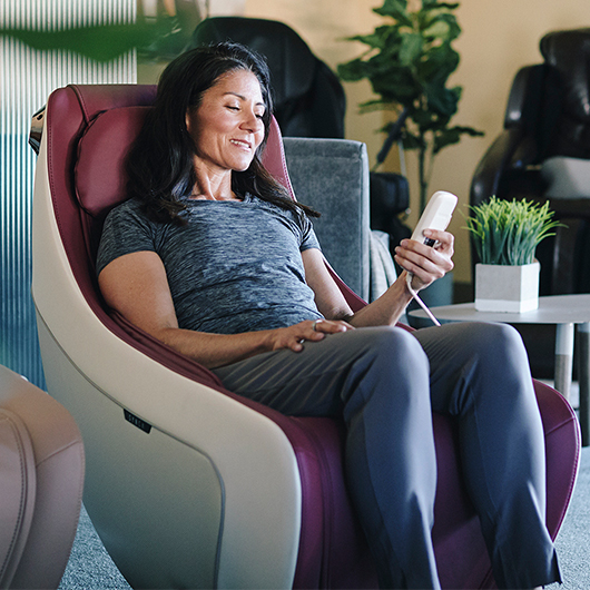 Woman sitting in massage chair
