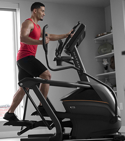 Man working out on a Matrix Suspension Elliptical