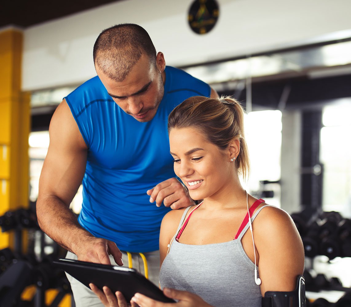 Personal Trainer showing results to client